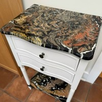 Earth tones end table with shelf and resin top